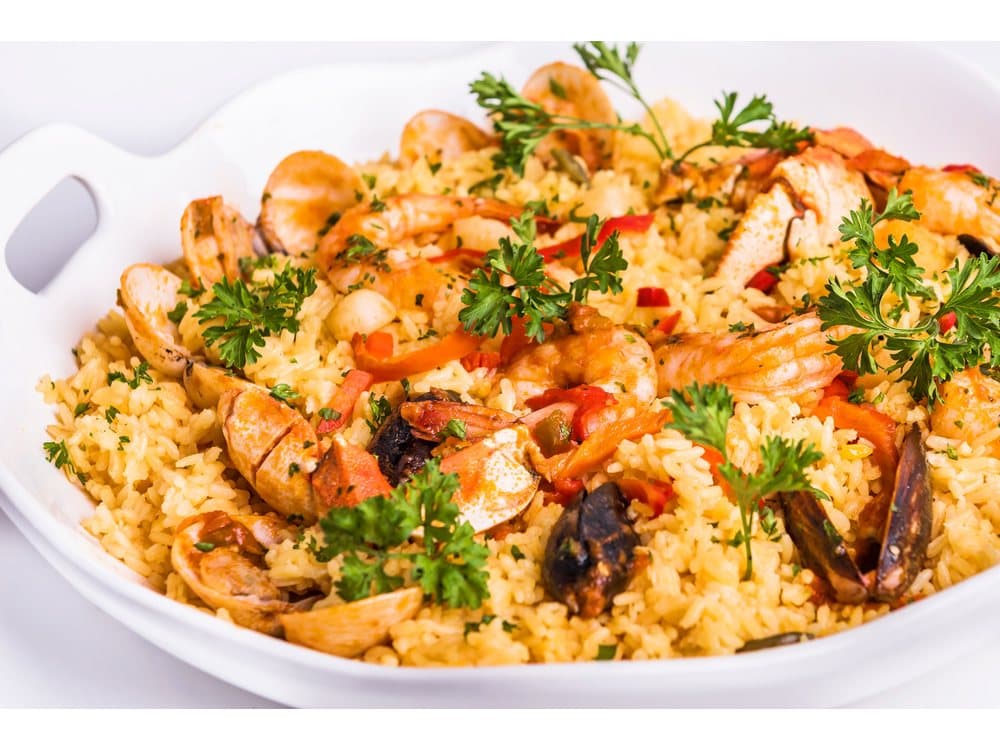 Paella Valenciana (Para Dos) — Paella Valenciana for two — shrimp, mussels, crab claws, white fish, calamari, chorizo and chicken cooked with yellow rice