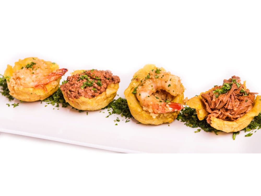 Tostones Rellenos (3) — Stuffed tostones — choice of beef or garlic shrimp. Add melted cheese $2