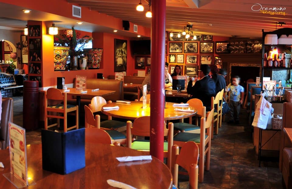 The Don Ramon dining room, with its photo wall and hand-painted Cuban ceramics